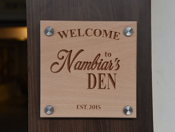 Engraved wooden nameplate in Thiruvananthapuram